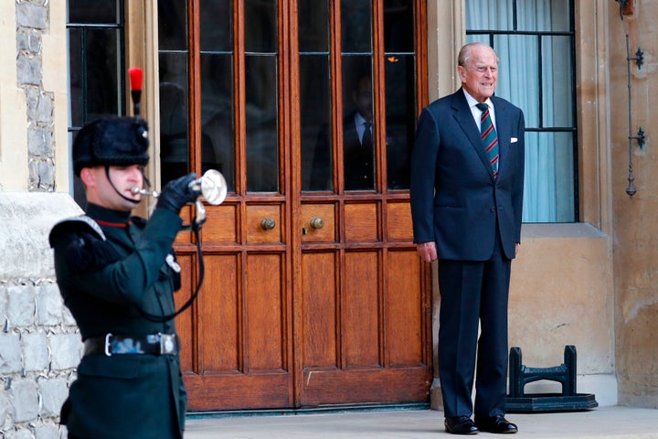 The Duke of Edinburgh listens to buglers during the transfer of the Colonel-in-Chief of The Rifles at Windsor castle in Windsor on July 22, 2020.