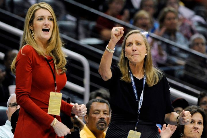 Kelly Loeffler (left), cheers on the Atlanta Dream basketball team, which she co-owns, during a game. She has become an outspoken opponent of a WNBA plan to publicly support the Black Lives Movement -- a position that has put her at odds with the Dream's players.