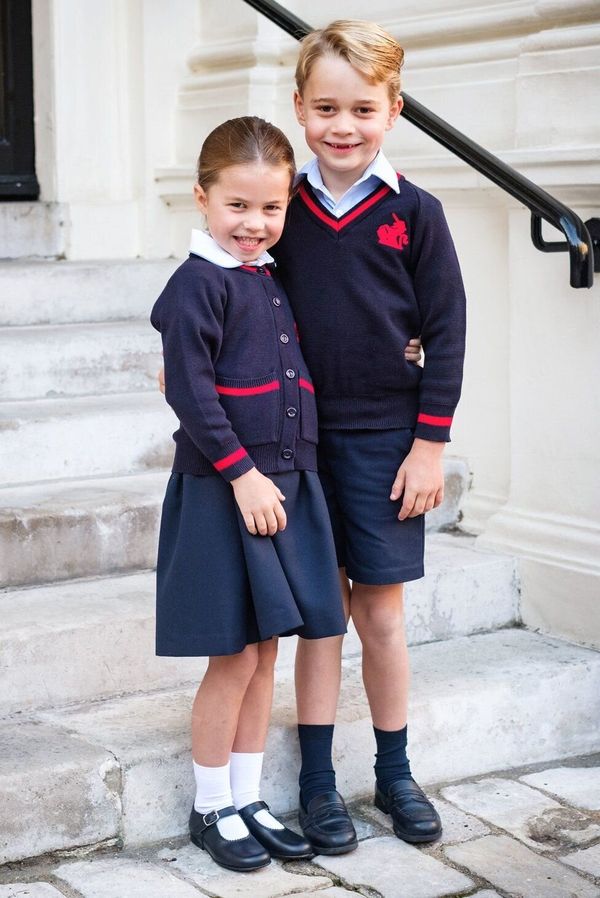 Princess Charlotte and Prince George smile at Kensington Palace before leaving for their first day at of school at Thomas's B