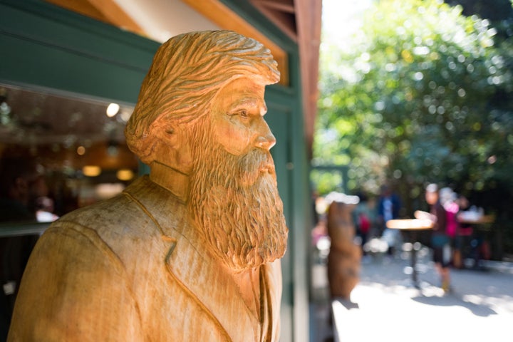 A carved, wooden statue of John Muir, who founded the Sierra Club, at Muir Woods National Monument, Mill Valley, California. (Photo via Smith Collection/Gado/Getty Images).