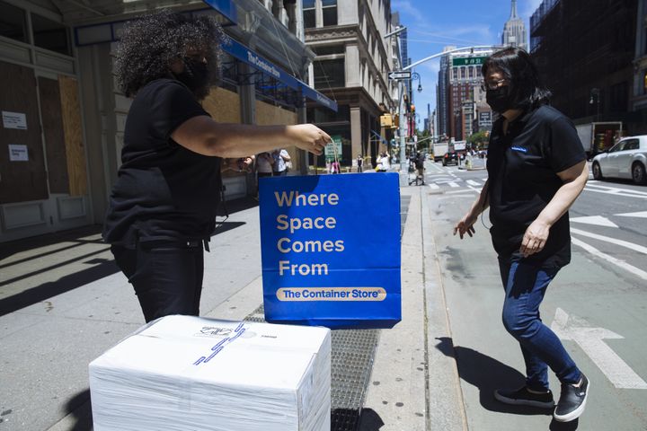 Curbside pickup at a Container Store location in New York in June. Container Store employees have to sign arbitration agreements if they want to go back to work after being furloughed.