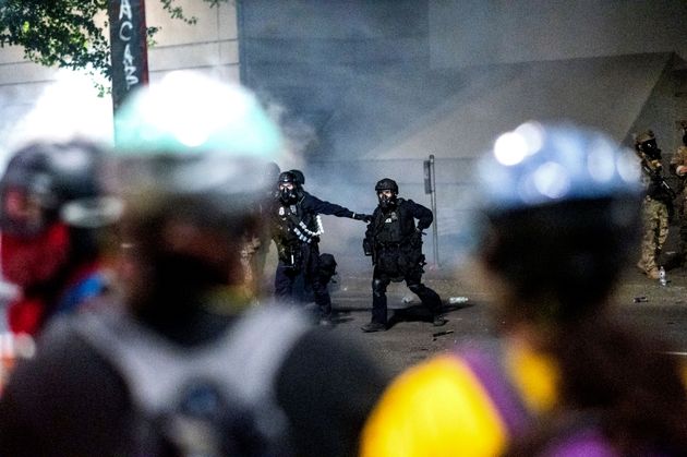 Federal officers prepare to disperse Black Lives Matter protesters at the Mark O. Hatfield United States Courthouse on Tuesday, July 21, 2020, in Portland