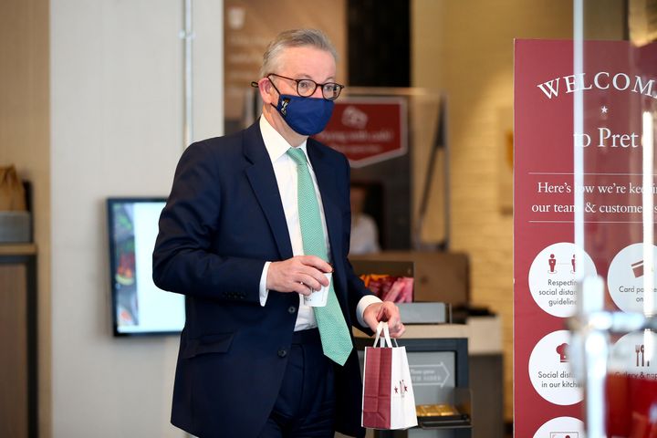 Michael Gove wears a face covering while buying food in Pret - having previously been pictured not.
