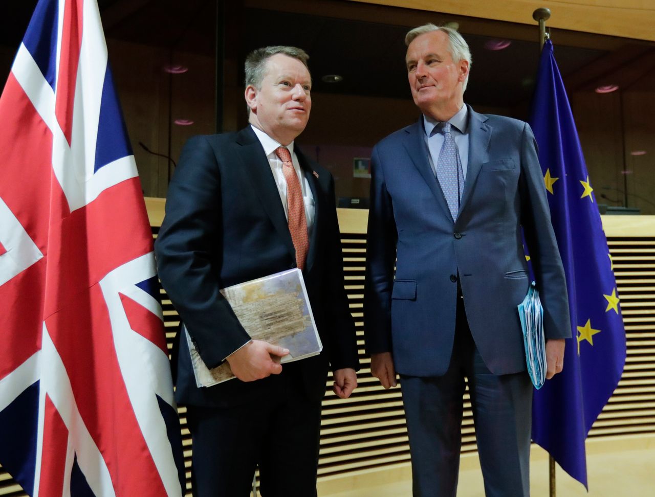 European Union chief Brexit negotiator Michel Barnier, right, speaks with the British PM's Europe adviser David Frost 