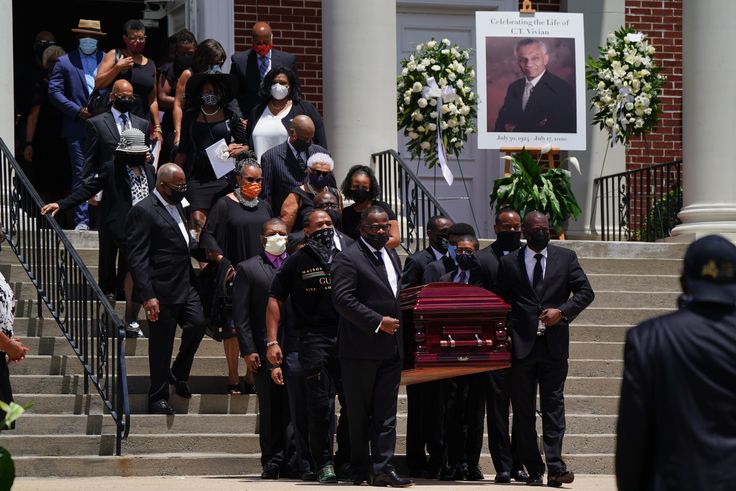 ATLANTA, GA - JULY 23: The casket holding the body of civil rights icon C.T. Vivian is carried out of Providence Missionary Baptist Church following his funeral service on July 23, 2020 in Atlanta, Georgia. Vivian, a close associate and friend of Martin Luther King Jr. was a renowned preacher who participated in the Freedom Rides and helped organize non-violent protest in the South during the 1960s. 
