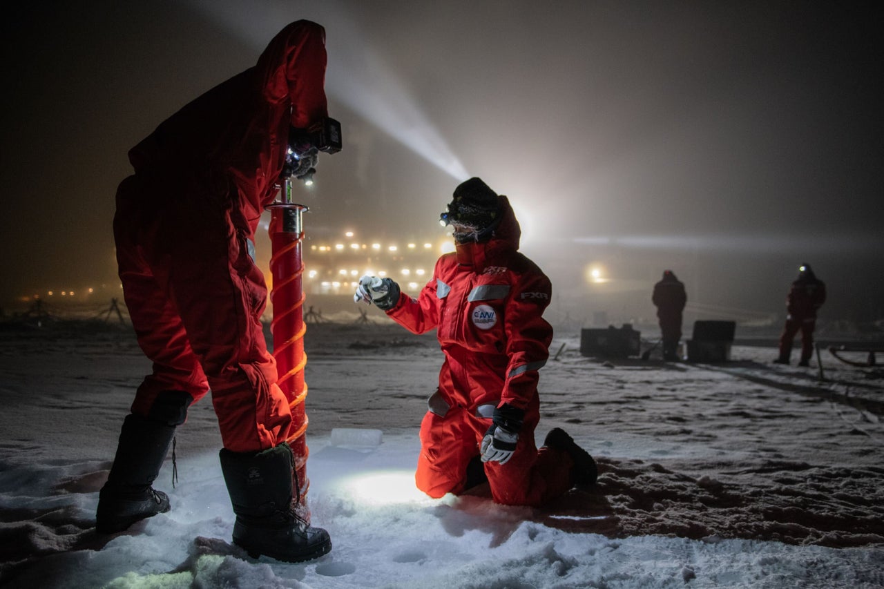 Scientific teams drill into the ice to extract core samples on the afternoon of Dec. 15, 2019.