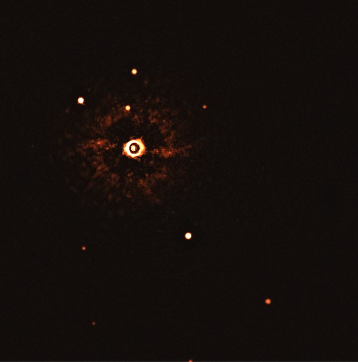 The star TYC 8998-760-1 with its two exoplanets, TYC 8998-760-1b (the noticeable dot in the image's center) and TYC 8998-760-1c (the dimmer dot near the lower right side). The other dots surrounding the star are background stars. 