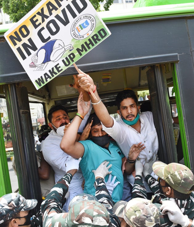 NSUI workers are detained after a protest demanding the cancellation of final year exams and promotion...