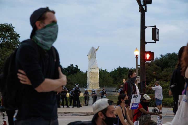 Activists stand at South Columbus Drive and East Roosevelt Road near the Christopher Columbus statue in Chicago on July 20, 2020. (Armando L. Sanchez/Chicago Tribune/Tribune News Service via Getty Images)