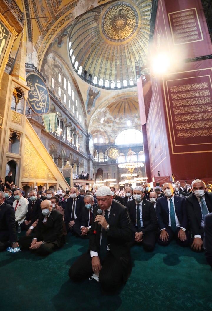 Turkey's President Recep Tayyip Erdogan, center, recites from the Quran during Friday prayers in Hagia Sophia on July 24, 2020. 