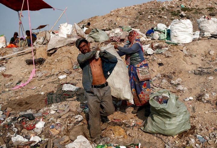 Mansoor Khan and his wife Latifa Bibi have been collecting scraps of plastic and other items at an enormous landfill site on the outskirts of New Delhi for nearly 20 years