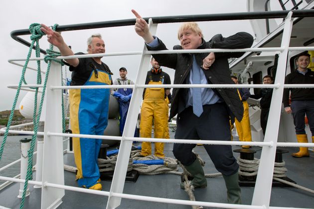  Boris Johnson speaks to members of the crew, on the Carvela at Stromness Harbour in Stromness, Orkney, Scotland, during a visit to the Highlands and Northern Isles of Scotland. 