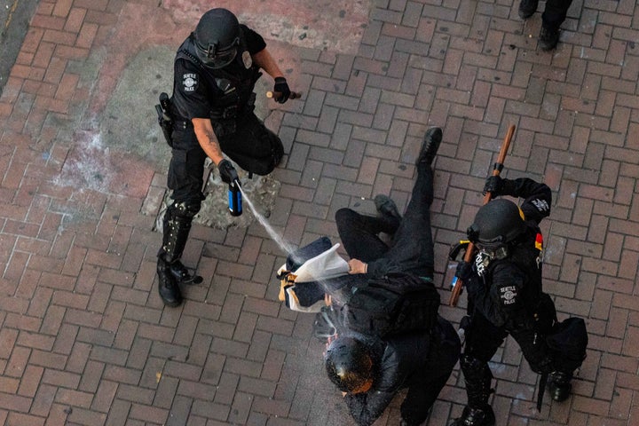 Police disperse demonstrators with pepper spray during protests in Seattle on July 25, 2020 in Seattle, Washington. 