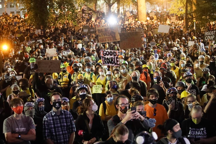 Demonstrators gather during a Black Lives Matter protest at the Mark O. Hatfield United States Courthouse Saturday, July 25, 2020, in Portland, Ore. (AP Photo/Marcio Jose Sanchez)