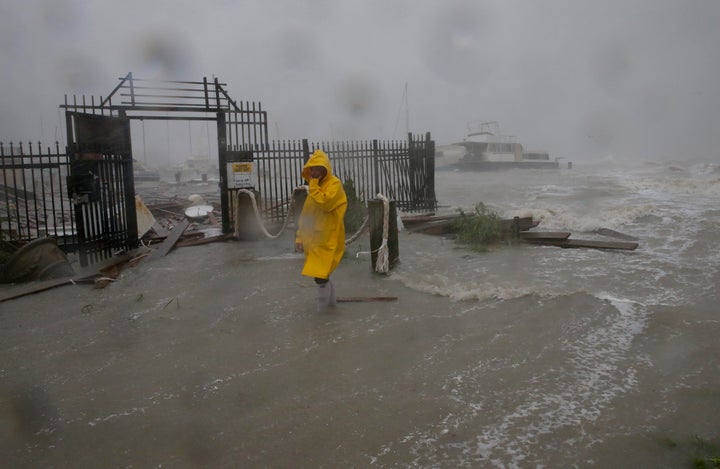 Jame Rowles examines the damage after the docks at the marina where his boat was secured were destroyed as Hurricane Hanna made landfall, Saturday, July 25, 2020, in Corpus Christi, Texas. (AP Photo/Eric Gay)