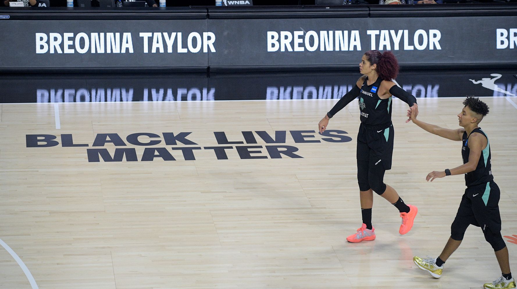 WNBA players walk off court before national anthem in WNBA season opener 