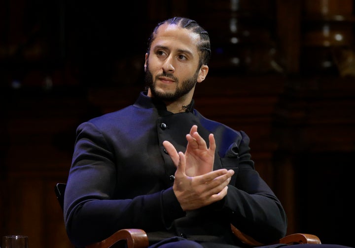 NFL football quarterback Colin Kaepernick applauds during W.E.B. Du Bois Medal ceremonies at Harvard University in Cambridge, Mass. on Oct. 11, 2018. Kaepernick has been condemned by President Donald Trump and others on the right and has not played an NFL game since 2016, when he began kneeling during the National Anthem to protest "a country that oppresses black people and people of color." But he has appeared in Nike advertisements, been honoured by the ACLU and Amnesty International among other organizations and reached an agreement with the Walt Disney Co. for a docuseries about his life.