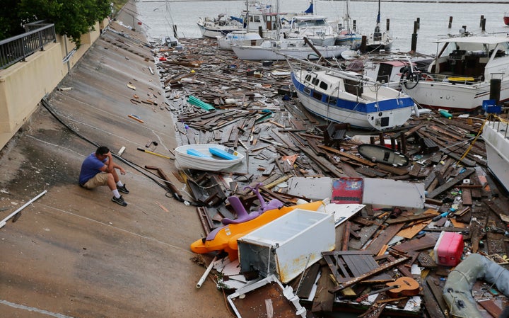 Allen Heath surveys the damage to a private marina after it was hit by Hurricane Hanna on Sunday in Corpus Christi, Texas.&nb