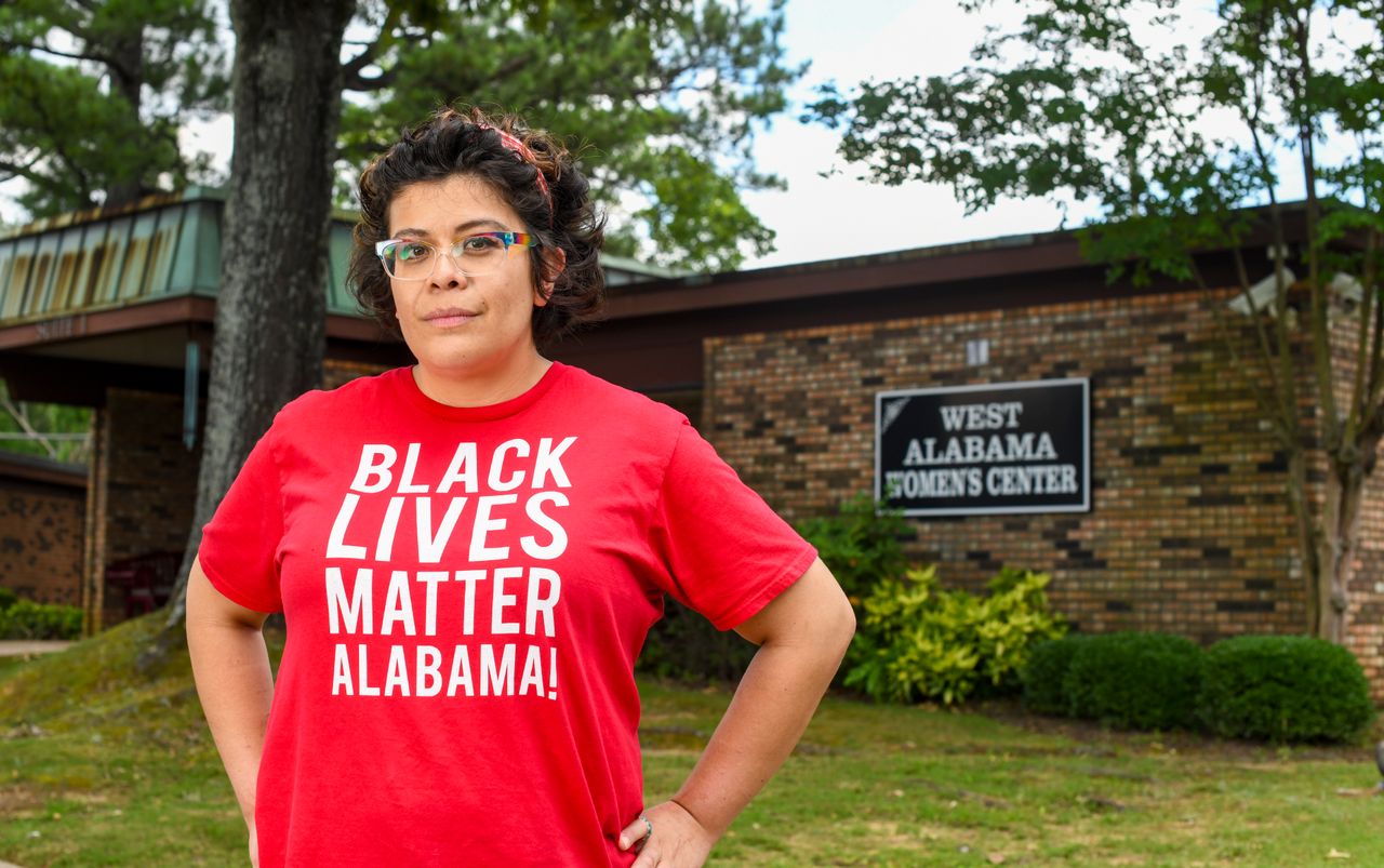 Activist Amanda Reyes stands outside West Alabama Women's Center on June 5. Reyes started the Yellowhammer Fund, which raised millions of dollars for abortion access and was able to purchase the last abortion clinic in west Alabama.