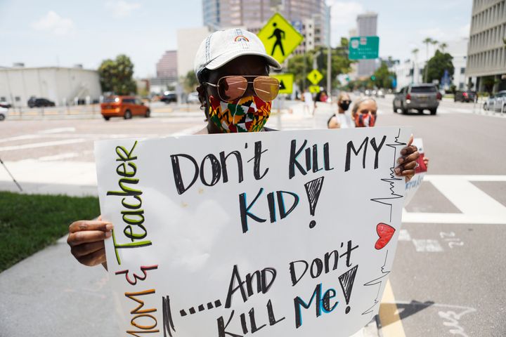 Business education teacher Malikah Armbrister took to the streets in Tampa earlier this month to protest the push for school reopenings in Florida that would include in-person instruction.