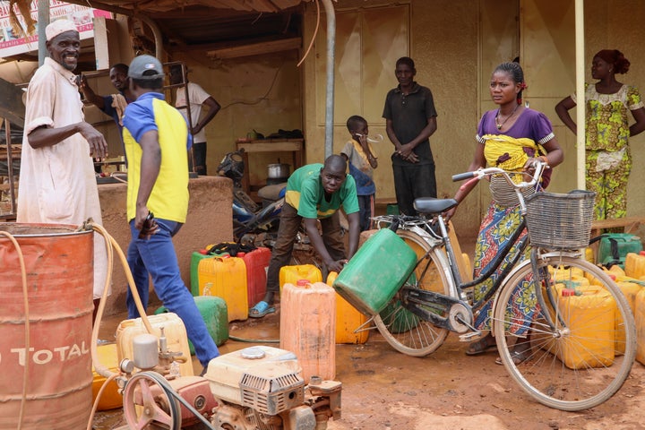 Burkina Faso is one of Africa's nations hardest hit by the coronavirus with one of the highest number of fatalities in sub-Saharan Africa. In this photo from March 24 , 2020, residents wait in line to fill their jerry cans, as people often have to walk half an hour to the closest water point several times a day and wait in crowded lines in order to get enough water to wash hands, bathe and cook.