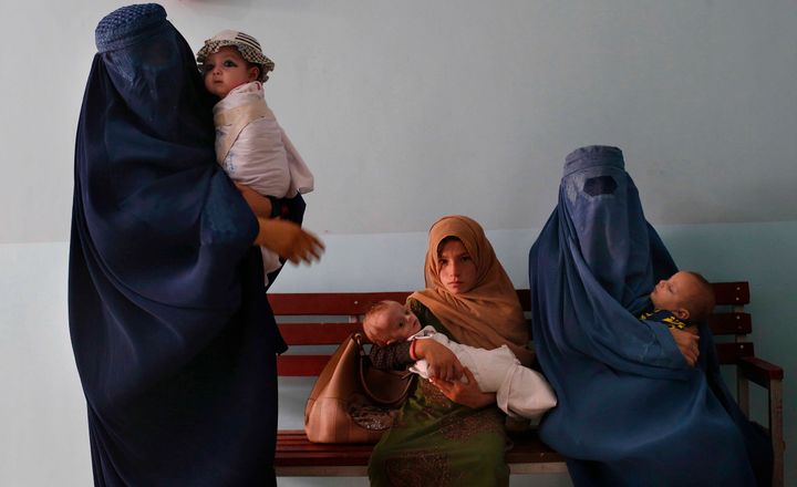 Mothers along with babies who suffer from malnutrition wait at a UNICEF clinic in Jabal Saraj, north of Kabul, Afghanistan on Aug. 26, 2019.