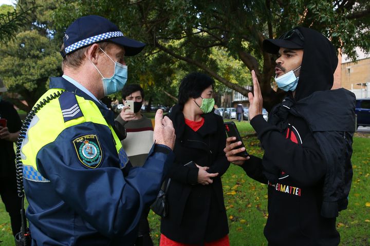 Police speak to rally organiser and nephew of David Dungay Jnr Paul Silva during a Black Lives Matter rally in The Domain on July 28, 2020 in Sydney, Australia. 
