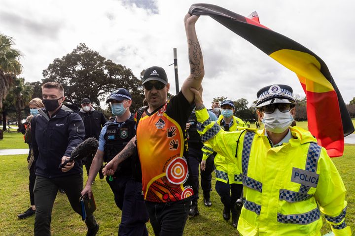 A man is detained by Police in the Domain on July 28, 2020 in Sydney, Australia. 