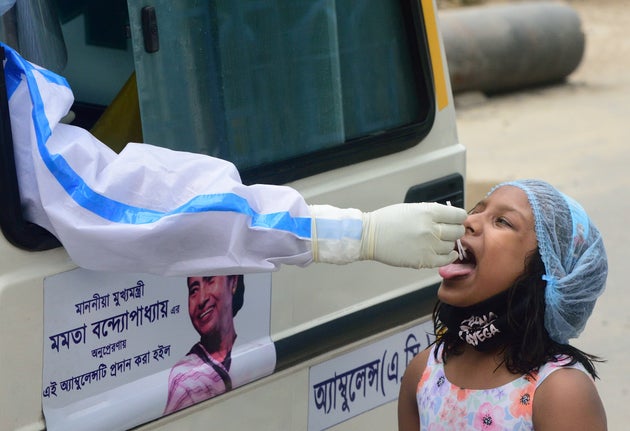 Kolkata Municipal Corporation health department conducts test on a girl in Kolkata on 27