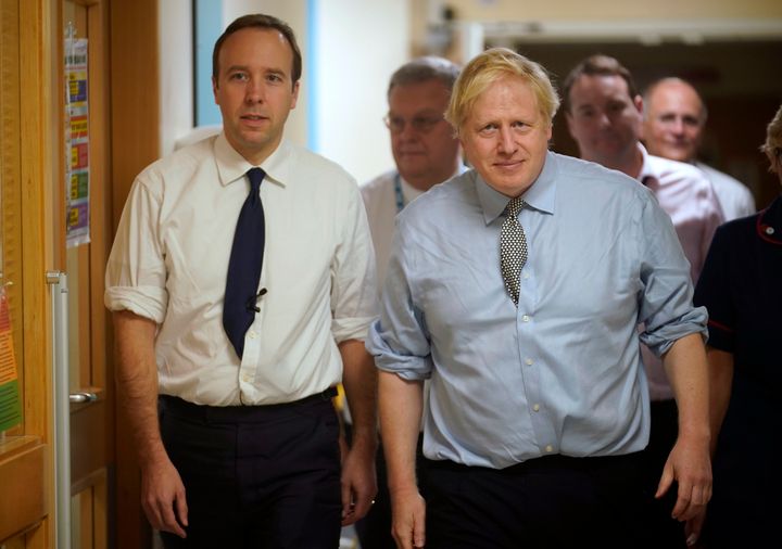 Health secretary Matt Hancock (L) and prime minister Boris Johnson