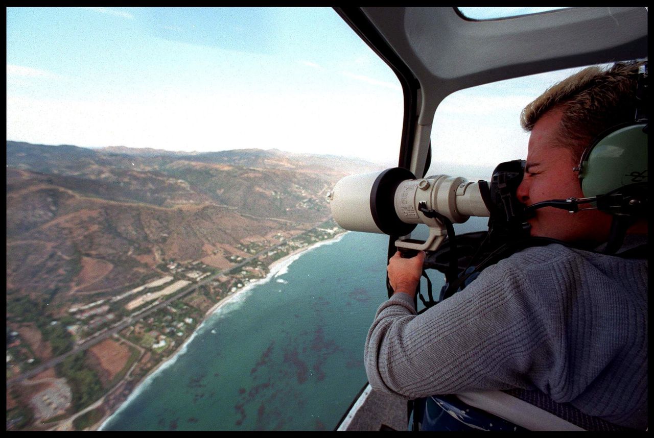 A Photographer takes an aerial view of Brad Pitt and Jennifer Aniston's wedding venue July 29, 2000 in Malibu, CA