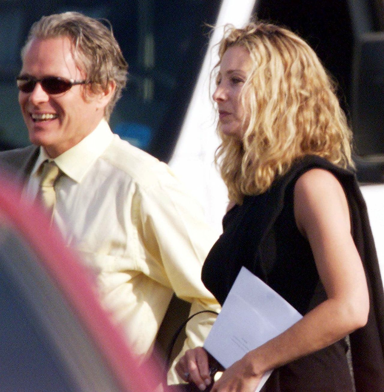 Lisa Kudrow and her husband arrive in Malibu, Calif., for the wedding of Jennifer Aniston and Brad Pitt