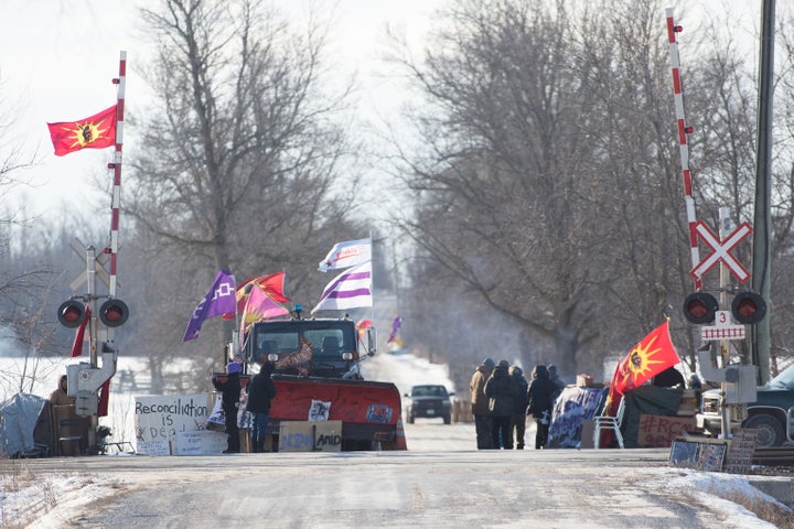 First Nations people protest at a train blockade in Tyendinaga, near Belleville, Ontario, Canada on Feb. 21. The blockades were put in place in solidarity with Wet'suwet'en First Nation hereditary chiefs who opposed a natural gas pipeline in their traditional territory in the province of British Columbia in Canada.