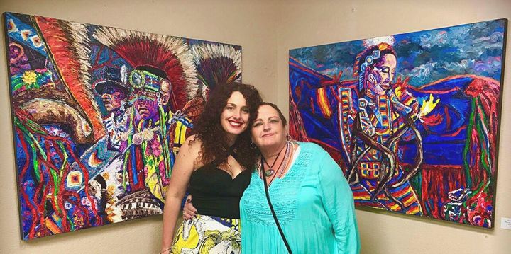 The author (left) and her mother, Meridy Volz, standing with two oil paintings by Meridy Volz in Palm Springs, California, in 2017.