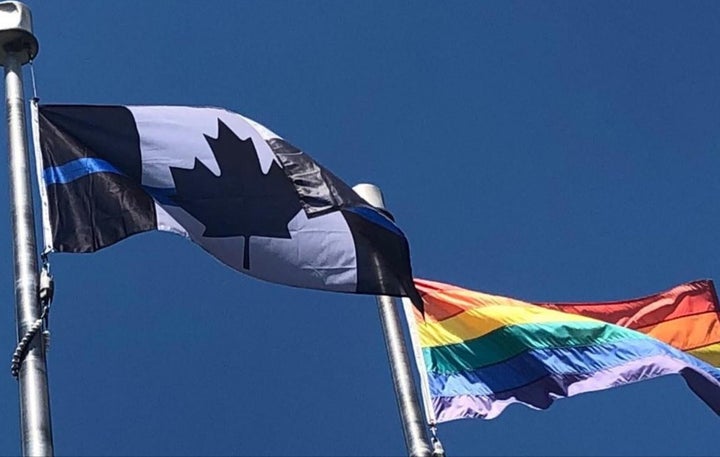 The Ontario Provincial Police Association replaced its red and white Canadian flag with a "thin blue line" version, similar to the one pictured here, outside of its Barrie, Ont. headquarters in June 2020. 