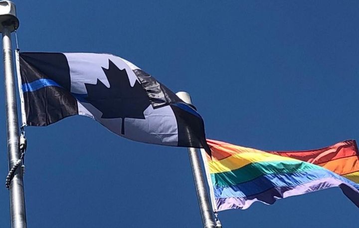 The Ontario Provincial Police Association replaced its red and white Canadian flag with a "thin blue line" version, similar to the one pictured here, outside of its Barrie, Ont. headquarters in June 2020. 
