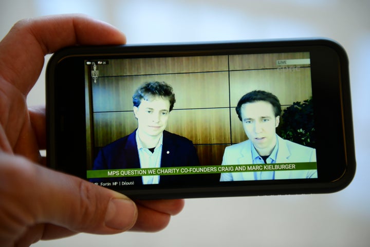 Marc Kielburger and Craig Kielburger are pictured on CPAC as they appear as witnesses via videoconference during a House of Commons finance committee in Ottawa on July 28, 2020.