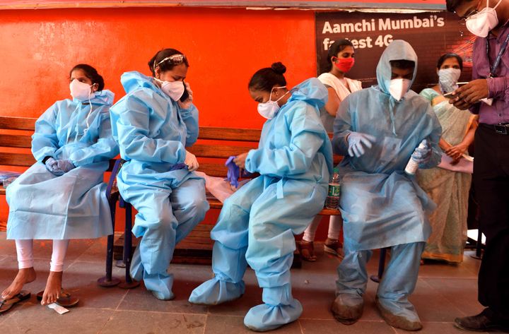A doctor of Indian Council of Medical Research take blood samples to conduct a population-based 'sero survey' in select districts of the country with an aim to monitor the trend in the prevalence of SARS-CoV-2 virus which causes the Covid -19 disease at Dharavi slums, on May 30, 2020 in Mumbai.
