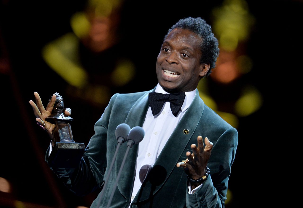 Kobna Holdbrook-Smith on stage at The Olivier Awards 2019 after winning the Best Actor in a Musical award.