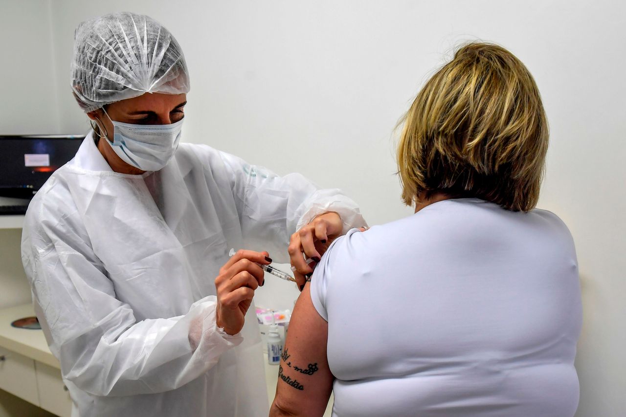 A volunteer takes part in the phase 3 trials of the ChAdOx1 nCoV-19 vaccine, developed by the University of Oxford together with the British pharmaceutical company AstraZeneca, in Brazil.