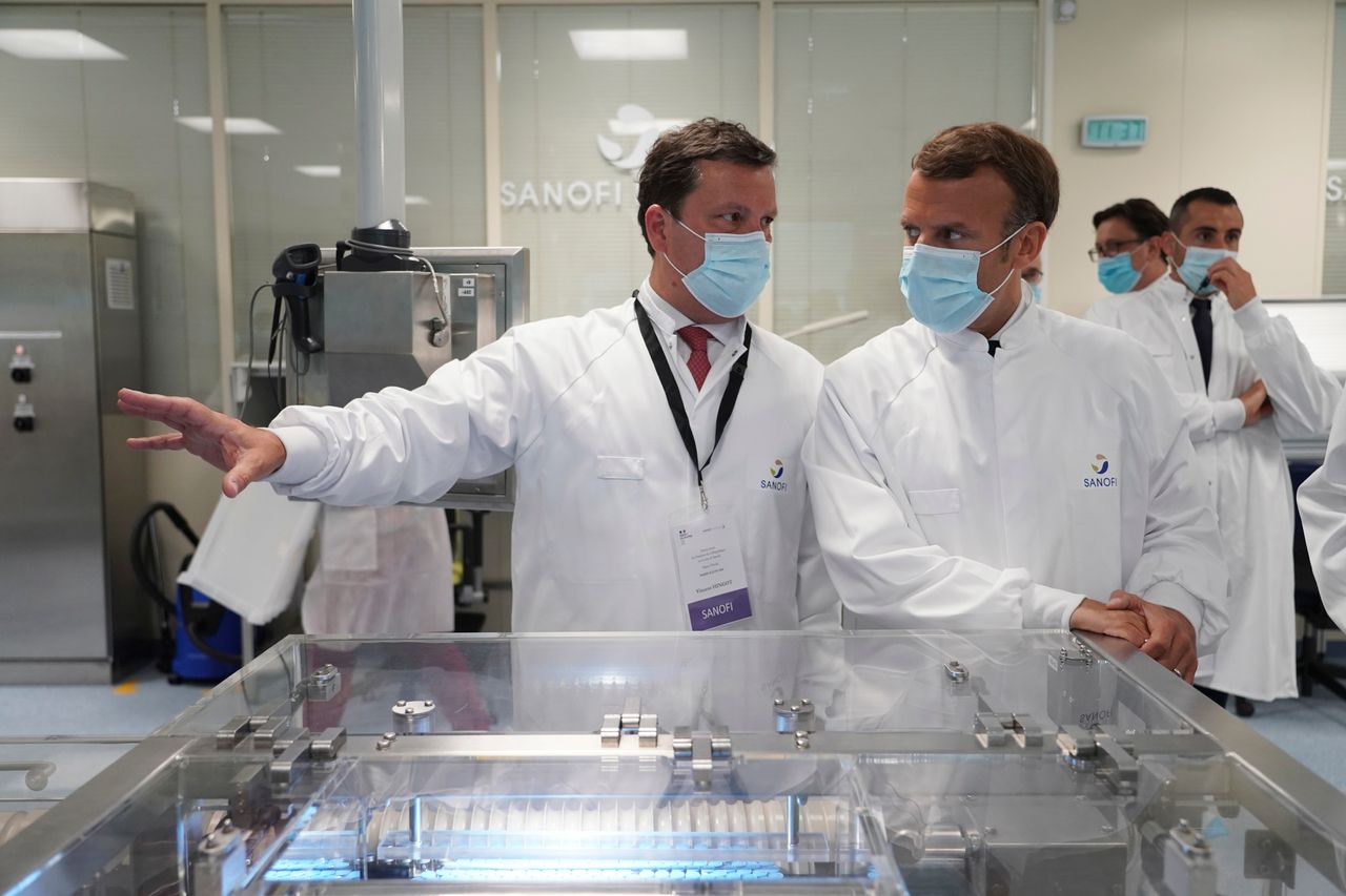 French president Emmanuel Macron visits an industrial development laboratory at French drugmaker's vaccine unit Sanofi Pasteur plant.