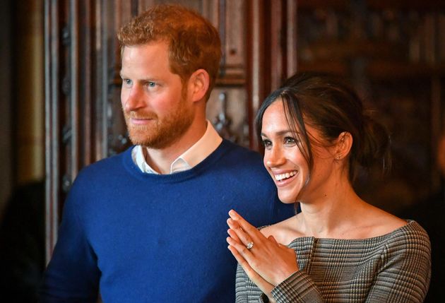 Harry and Meghan watch a performance by a Welsh choir in the banqueting hall during a visit to Cardiff Castle on Jan. 18, 2018, in Cardiff, Wales.