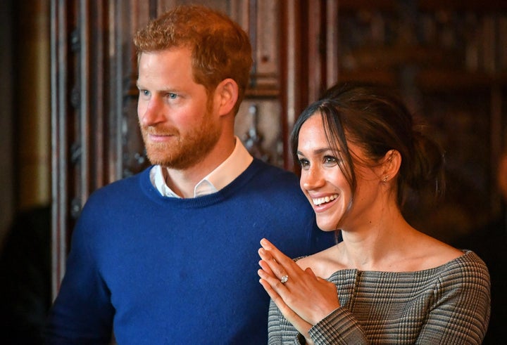 Harry and Meghan watch a performance by a Welsh choir in the banqueting hall during a visit to Cardiff Castle on Jan. 18, 2018, in Cardiff, Wales.