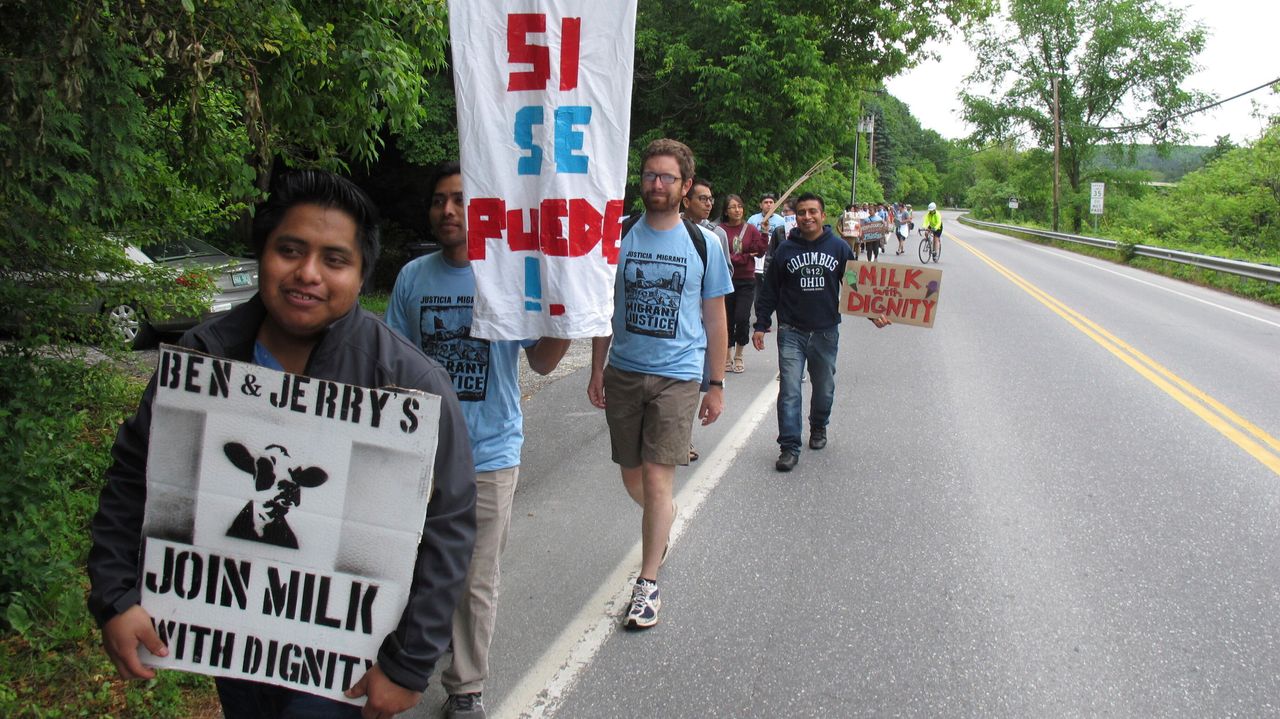 Dairy farm workers and activists march in 2017 to the main Ben & Jerry's production facility in Vermont to call for "Milk With Dignity," a campaign to obtain fair wages and living conditions for migrant workers.