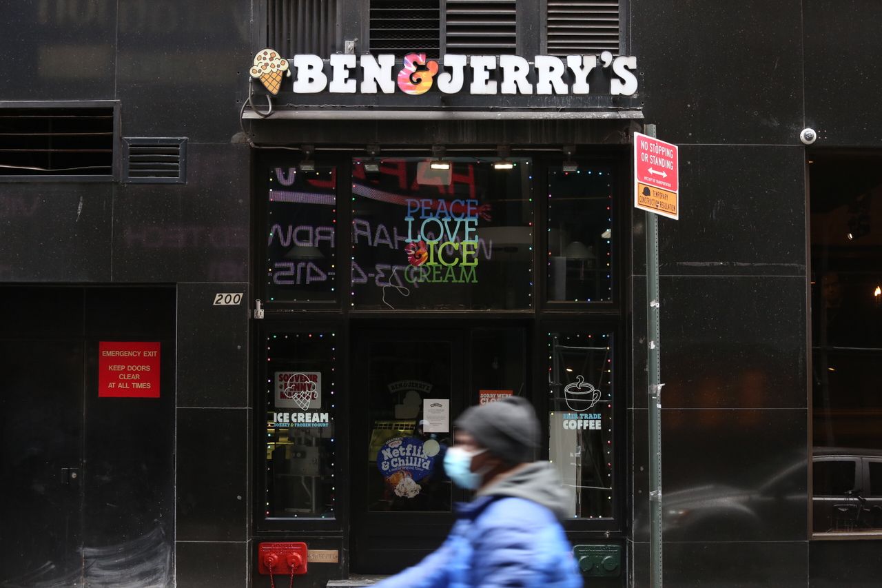 A person walks past Ben & Jerry's during the coronavirus pandemic in New York City.