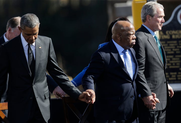 President Barack Obama, Rep. John Lewis, and former President George W. Bush hold hands on March 7, 2015, during a ceremony marking the 50th anniversary of the "Bloody Sunday" events at the Edmund Pettus Bridge in Selma, Alabama.