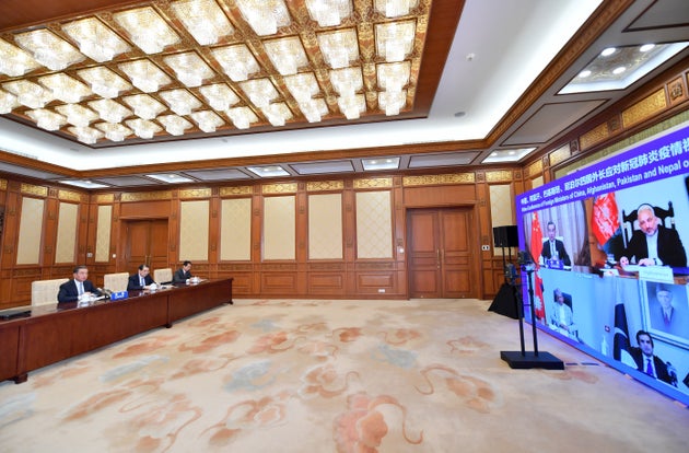 Chinese Foreign Minister Wang Yi hosts a video conference with foreign ministers of Afghanistan, Pakistan...