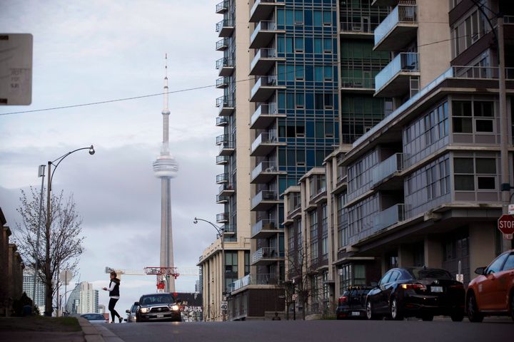 The CN Tower can be seen behind condos in Toronto's Liberty Village community in Toronto, Ontario on April 25, 2017. As rent cheques come due, some are warning that Ontarians should prepare for a wave of evictions now that protections put in place earlier in the COVID-19 pandemic have been lifted.