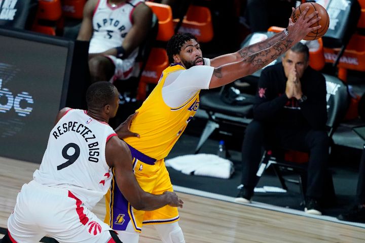 Serge Ibaka posts up against Anthony Davis of the Los Angeles Lakers.
