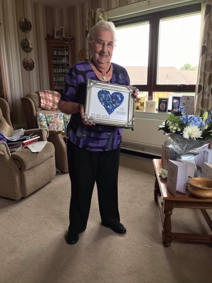 Margaret Davidson with an anniversary gift made by her husband.